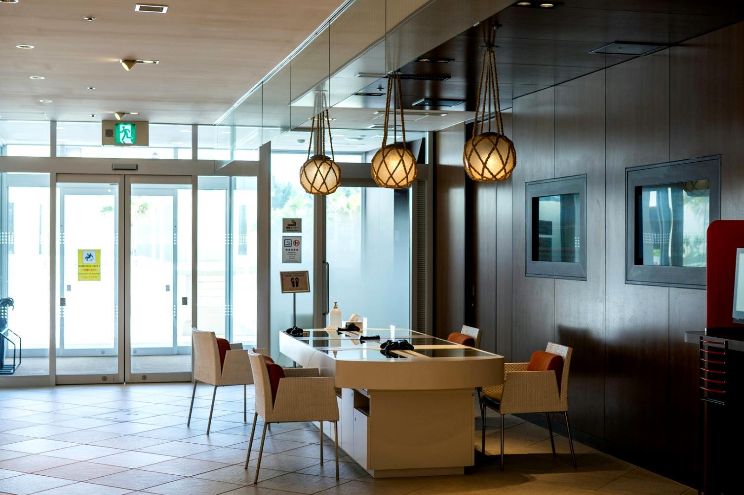 Organized workspace setup with financial documents and laptop showing remote learning materials