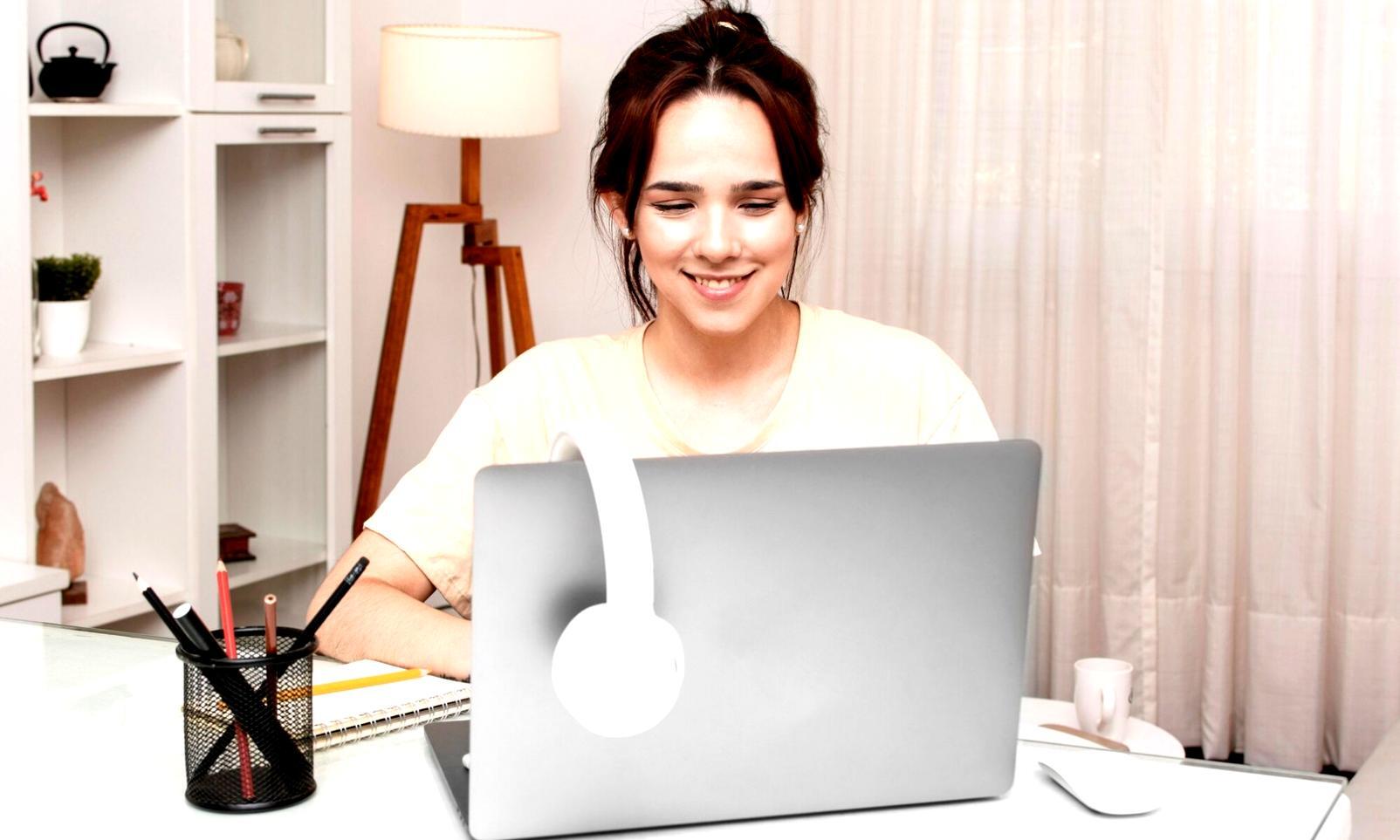 Home workspace showing financial planning tools and remote learning setup